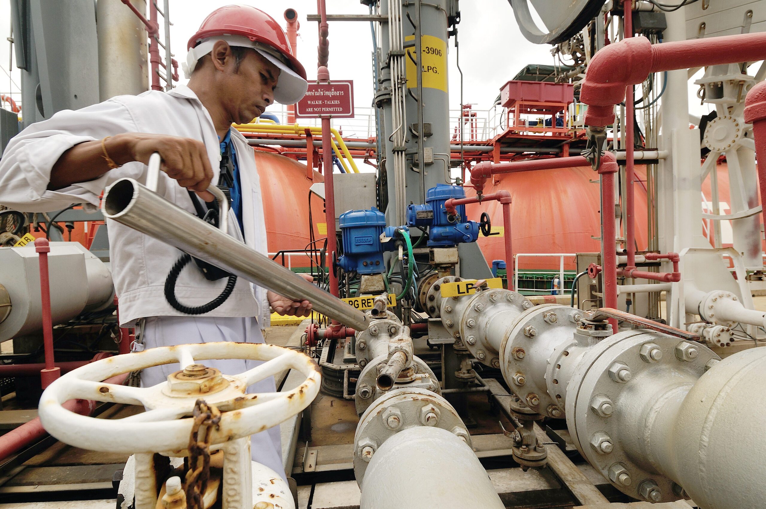 Workers preparing for loading crude oil form ship to taker in Chonburi, Thailand