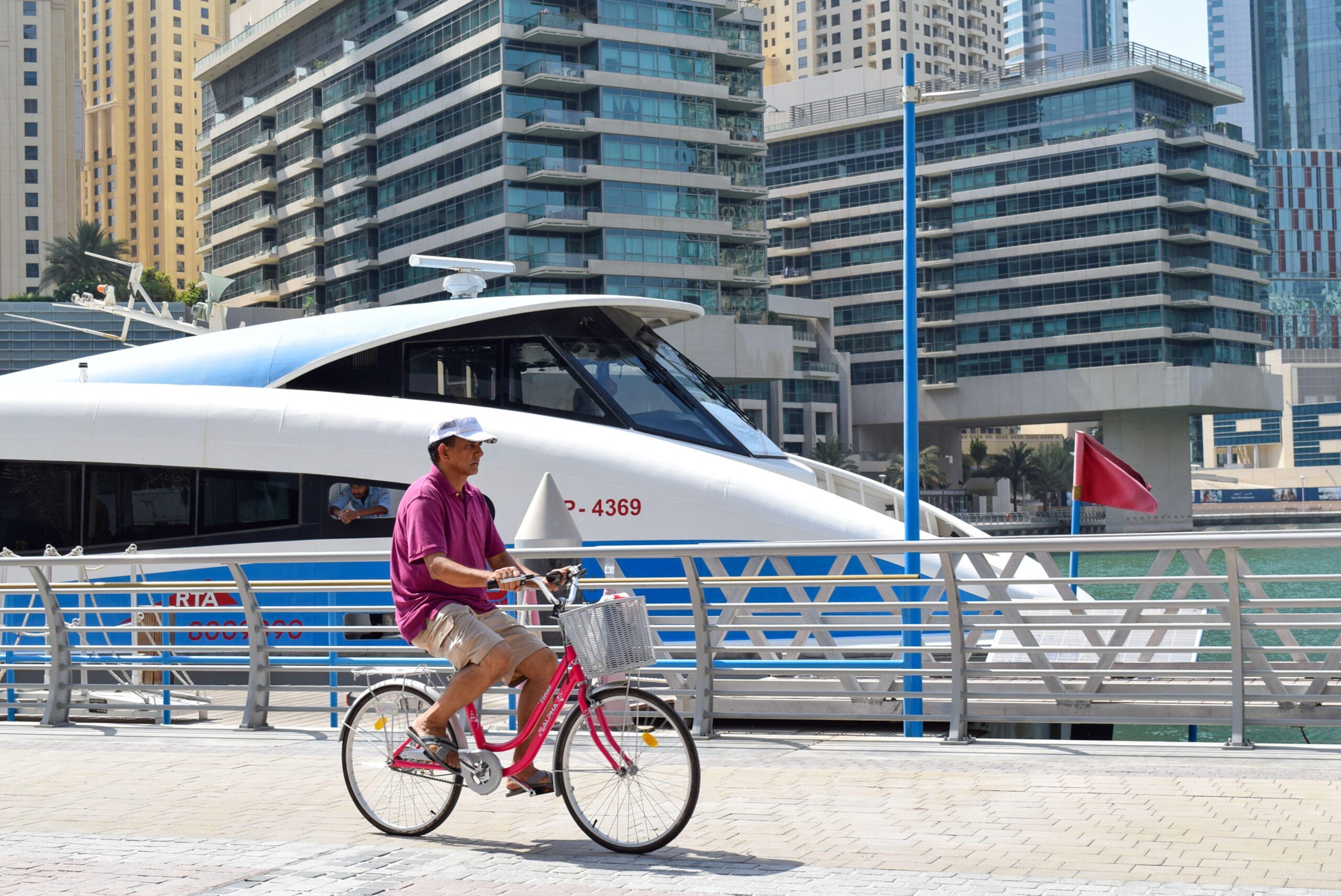 A tourist man riding a bicycle inside the city