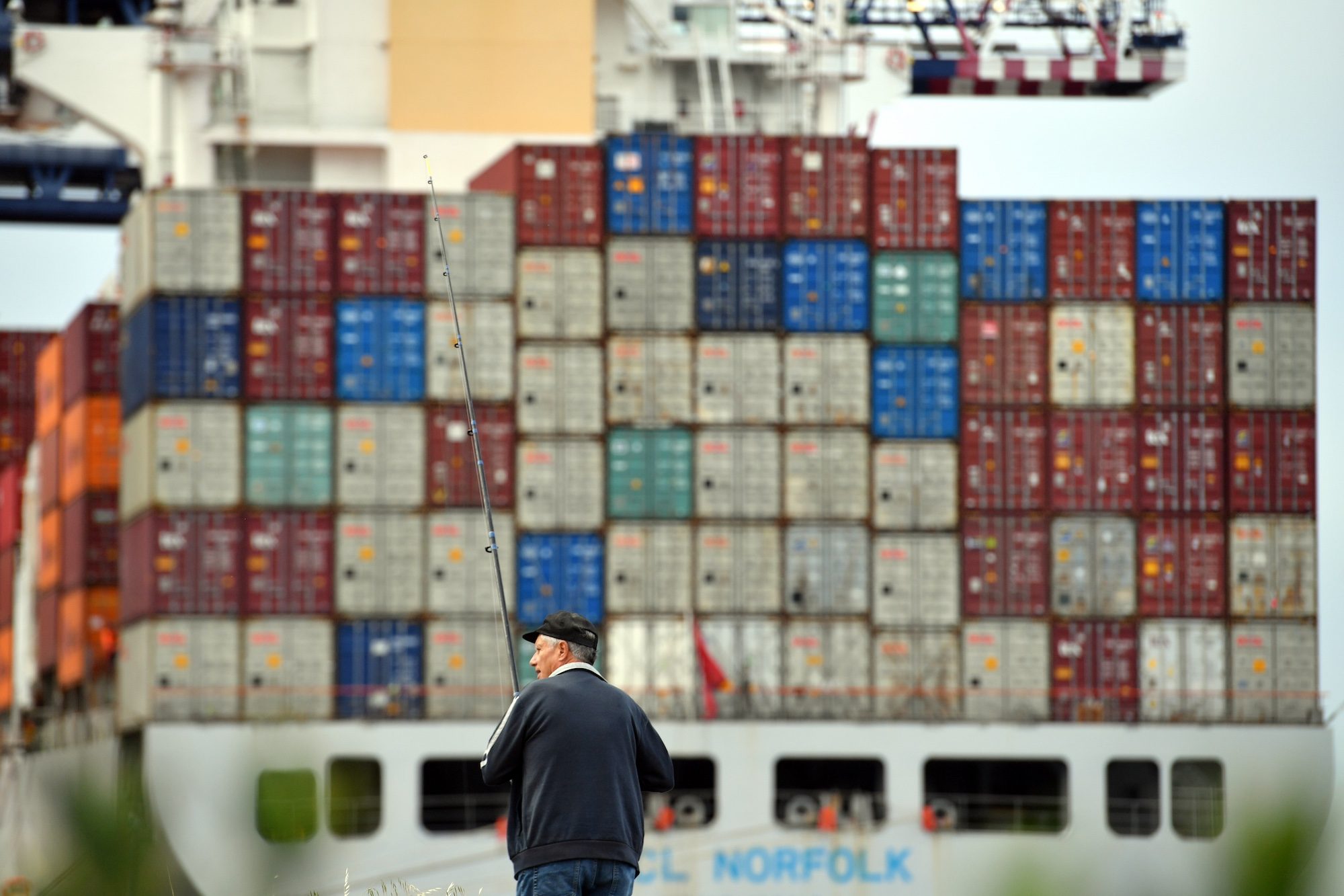 A fisherman at Port Botany in Sydney, where rail capacity is set to double