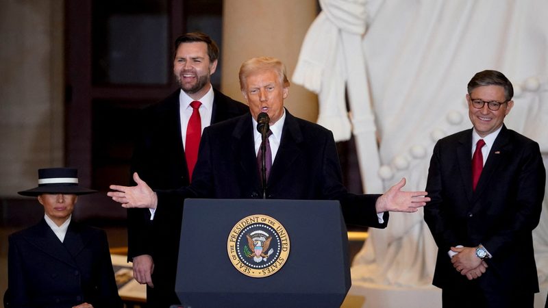 Donald Trump, flanked by the first lady Melania Trump, Vice President JD Vance and US House speaker Mike Johnson, addressed energy and trade at his inauguration