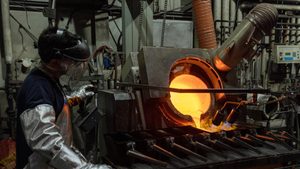 Gold is moulded into bars at a refiner in Switzerland. An orders backlog means US banks are widening their search for kilobars