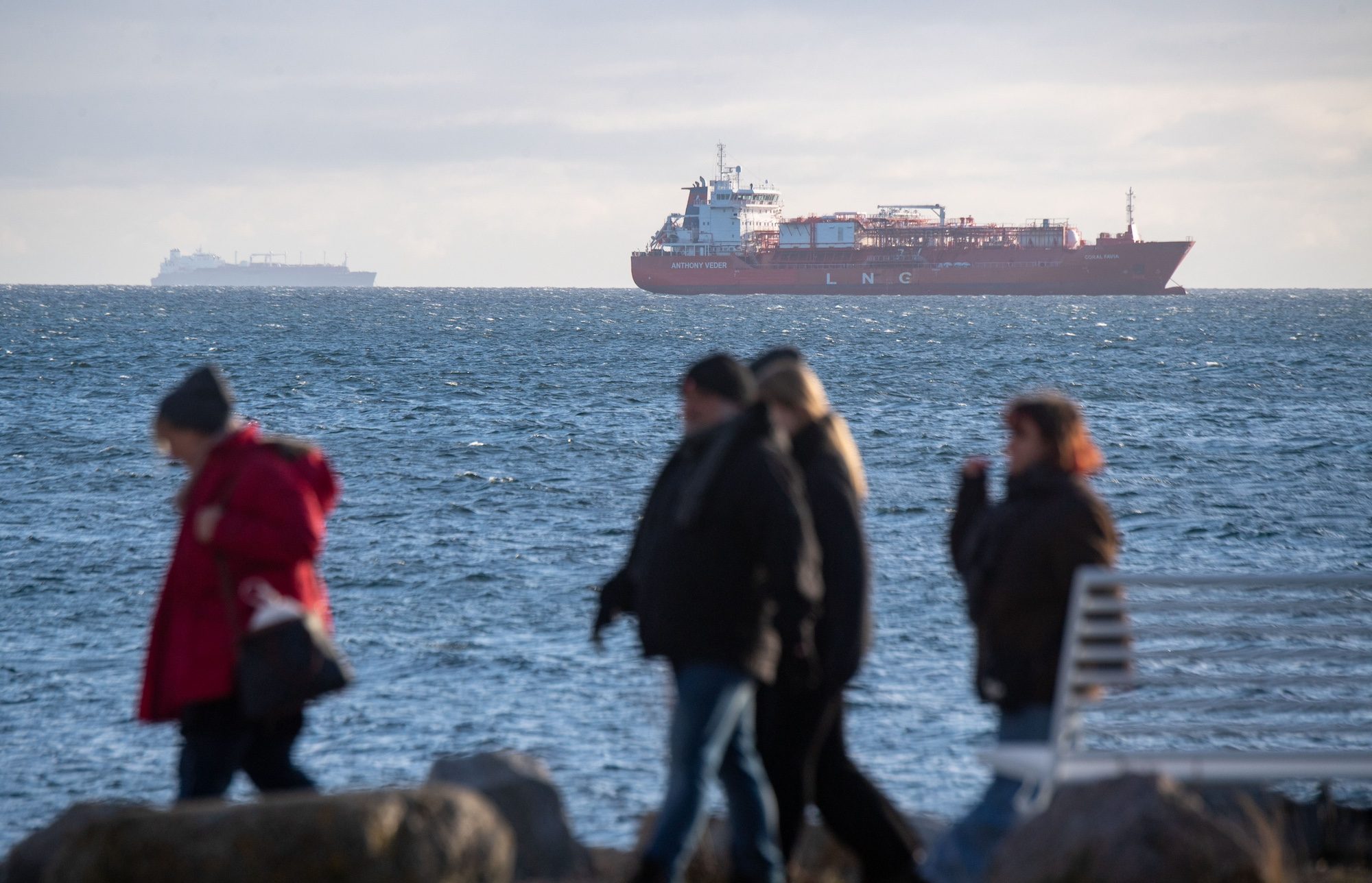 The 'Seapeak Hispania' is seen in the background, loaded with 140,000 cubic meters of liquefied natural gas from Egypt, bound for Sassnitz in Germany