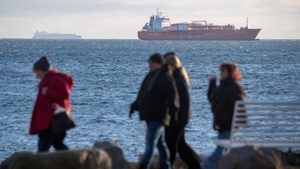 The 'Seapeak Hispania' is seen in the background, loaded with 140,000 cubic meters of liquefied natural gas from Egypt, bound for Sassnitz in Germany