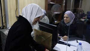 Employees at a government building in Damascus. The US has kept sanctions in place on Syria's central bank