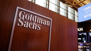 Indoors, Interior Design, Wood The logo for Goldman Sachs on the trading floor at the New York Stock Exchange. The investment bank kept its 2025-26 oil price forecasts unchanged