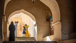 A family visits Rustaq Fort in northern Oman. The country's tourism strategy focuses on its historic sites