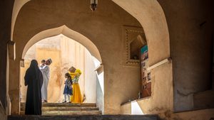 A family visits Rustaq Fort in northern Oman. The country's tourism strategy focuses on its historic sites