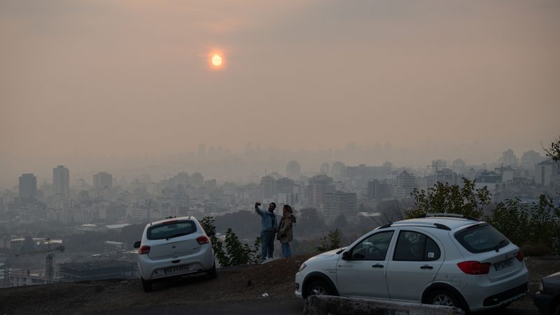 Smog hangs over Tehran; industry sources in Iran anticipate that tighter sanctions could reduce exports by another 200,000 bpd