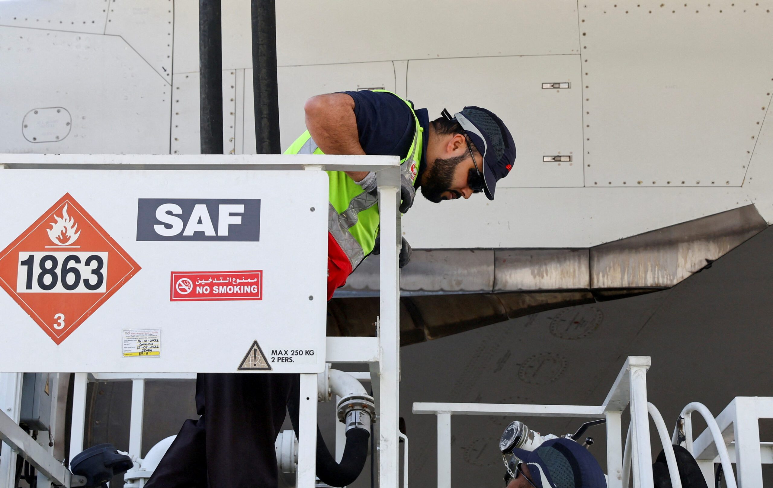 An Emirates plan fills up with sustainable aviation fuel before a test flight. Fuel compliance costs could reduce the airline's margins