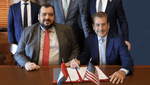 Senior ADQ and EPC executives signing the agreement to jointly build power generation and energy infrastructure