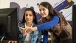 Arabic AI two women at a computer screen