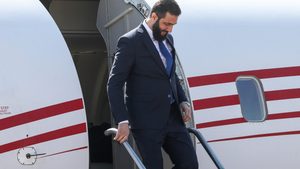 Syria's interim President Ahmed al-Sharaa disembarks an airplane. He has repeatedly called for the lifting of sanctions
