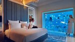 A couple enjoy the luxury of the Underwater Suite at Dubai's Atlantis hotel