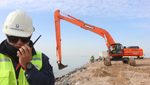 Workers use an excavator at the Faw port project site in Faw, in the southern province of Basra, January 6, 2016. REUTERS/Essam Al-Sudani