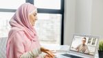 Pc screen view, islamic woman dressed in national hijab talking with male colleague, chatting using virtual modern video conference application, communicating from home, enjoy distant conversation