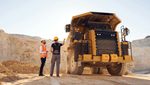 Two men at a minig site with a vehicle. Ma'aden says it intends to invest heavily after profits bounced back