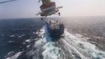 A Houthi helicopter flies over a cargo ship in the Red Sea. The group has carried out more than 100 attacks on ships since November 2023