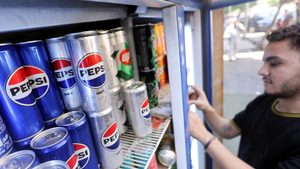 A supermarket owner in Cairo stocks a fridge. Egypt and Turkey helped power 11 percent revenue growth in PepsiCo’s international beverages business