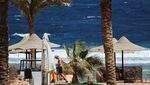 A tourist walks near the water at Egypt's Red Sea coast in Marsa Alam