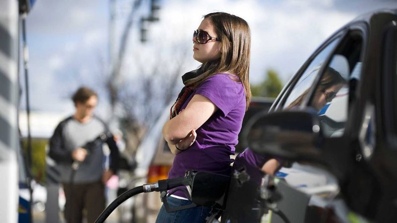 Drivers fill up at a petrol station in California. If Donald Trump tones down his tariffs this may reintroduce positive sentiment to oil markets