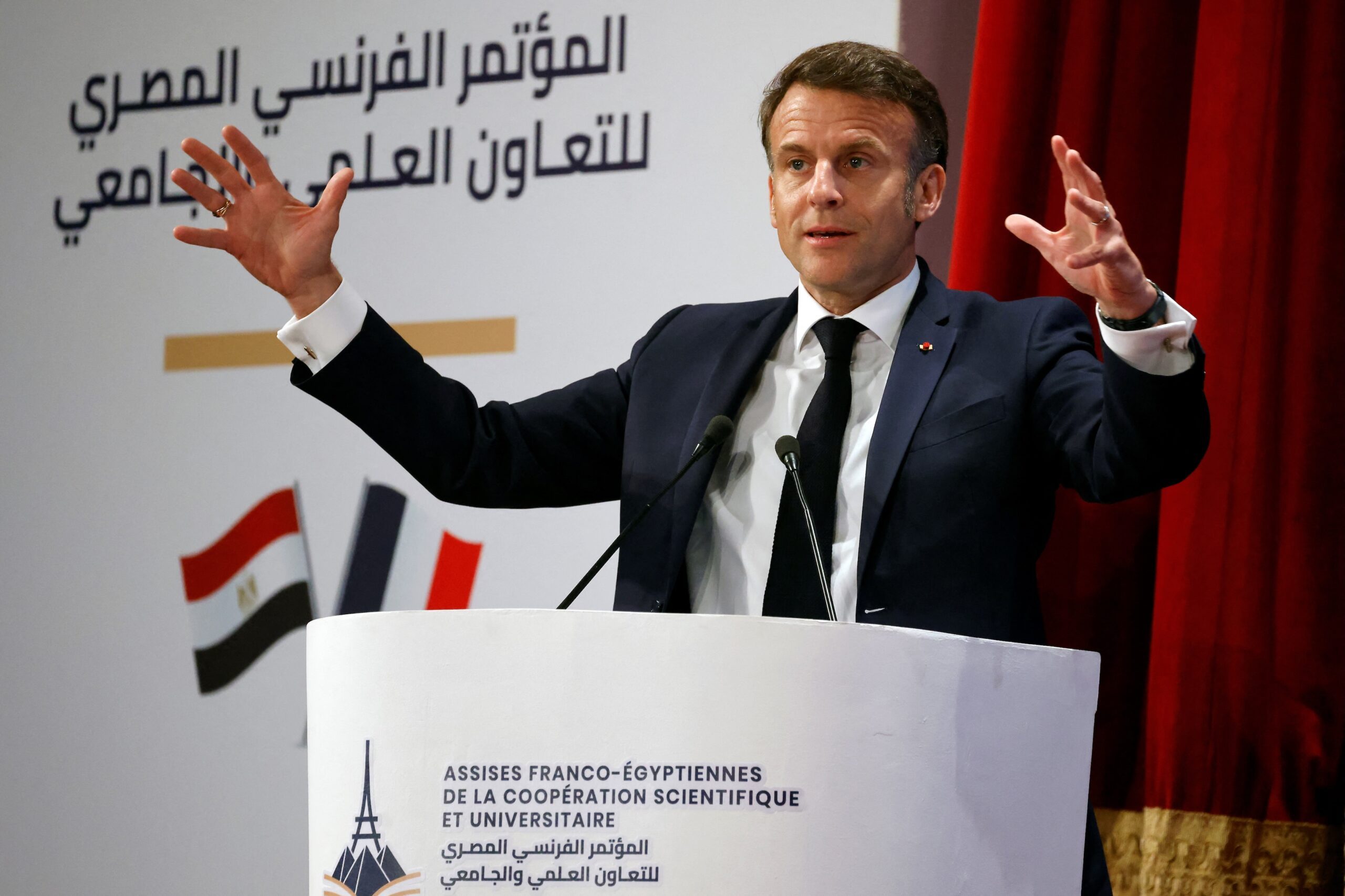 President Emmanuel Macron delivers a speech during his state visit to Egypt
