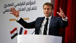 President Emmanuel Macron delivers a speech during his state visit to Egypt
