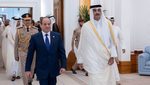Qatar's Emir Sheikh Tamim Bin Hamad Al Thani, right, and Egypt's President Abdel Fattah El-Sisi in Doha