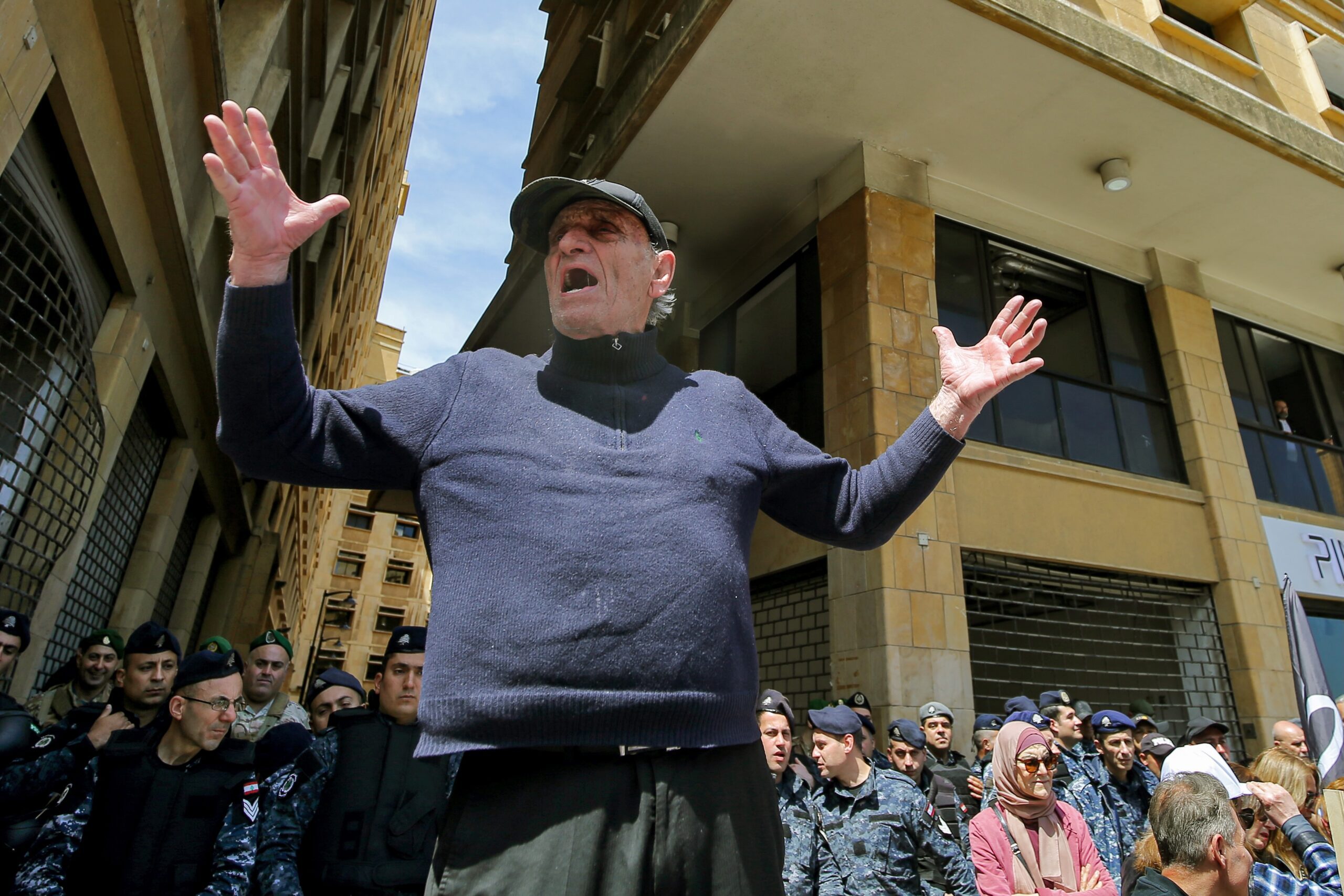 A Lebanese bank customer protests outside the Ministry of Economy in Beirut. Depositors have faced cash-withdrawal restrictions since 2019