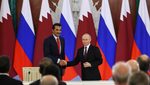 Qatar's Emir Sheikh Tamim Bin Hamad Al Thani and Russia's President Vladimir Putin attend a signing ceremony following their talks at the Kremlin in Moscow on April 17, 2025