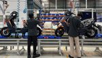 Workers assemble electric scooters at Ather Energy's factory in Hosur, Tamil Nadu. Adia says it has an "extensive portfolio" of Indian investments