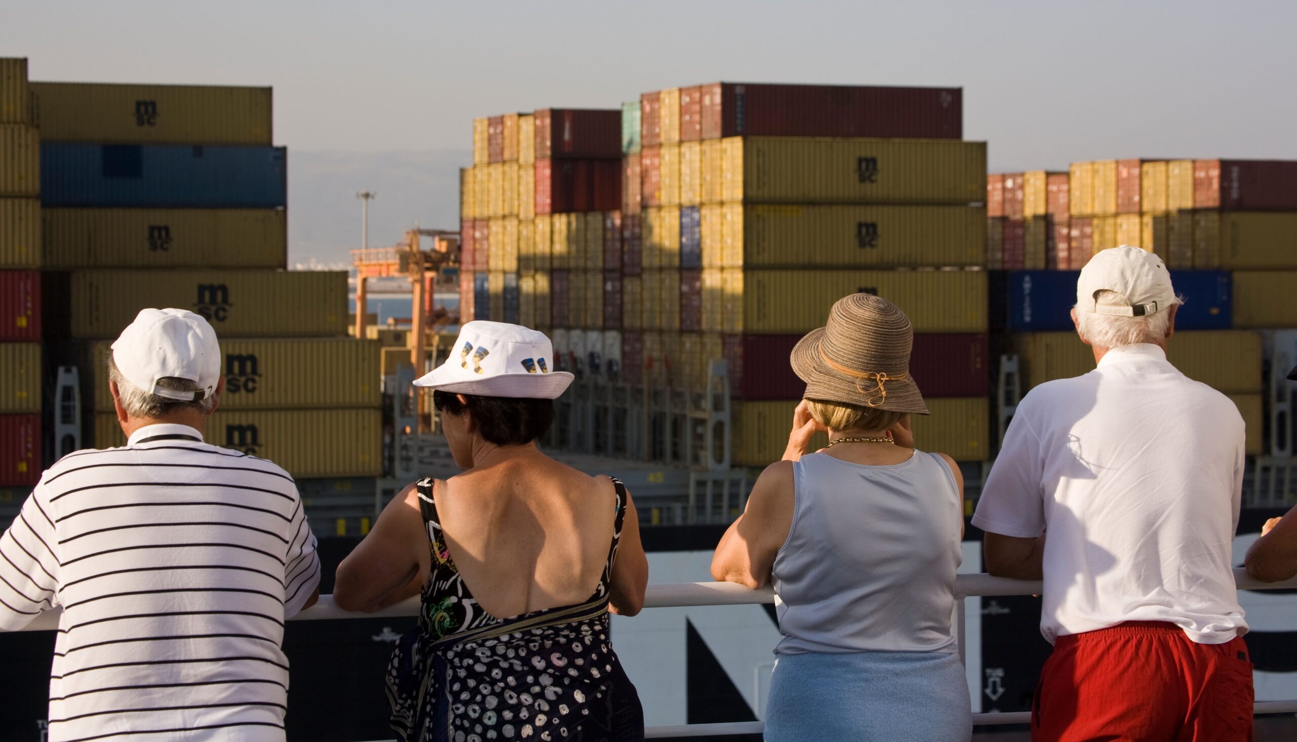 Cruise passengers observe activities at Port Raysut in Oman. Trump's tariff shock could affect regional trade and tourism