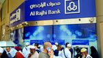 Customers use Al Rajhi cash dispensers at a branch in Mecca. The bank's total assets have topped SAR1 trillion