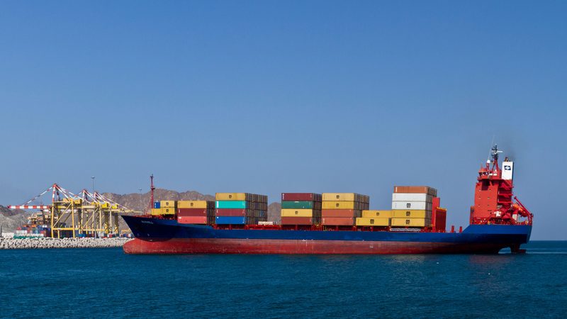 A container ship entering Port Sultan Qaboos in Muscat, Oman