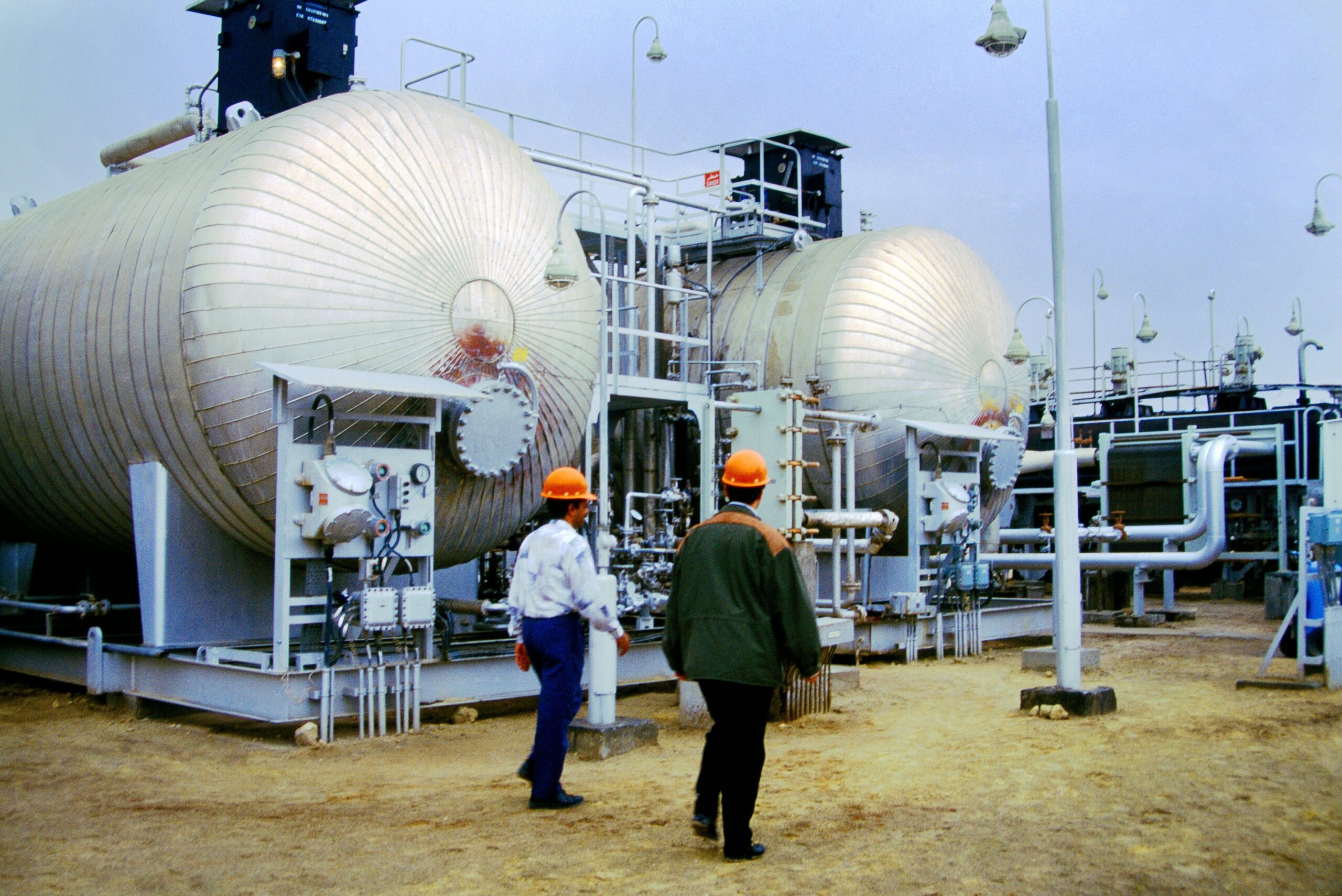 Workers pictured at Kuwait's Burgan oilfield in the 90s. The field has been producing since 1946