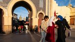 Young ladies walk out of the Bab Bou Jeloud also known as the Blue Gate which is one entrance of the medina of Fes el-Bali in Morocco on the February 17 2025. The door is blue on the outside or west but green on the other side. Des jeunes filles sortent de la Bab Bou Jeloud egalement connue sous le nom de Porte Bleue qui delimite la medina de Fes el-Bali au Maroc le 17 fevrier 2025. La porte est bleue sur l exterieur soit l ouest mais verte sur l autre versant.