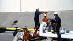 Oil Terminal Pipes Stop Valve Guest Workers Men In Hard Hats Storage Tank