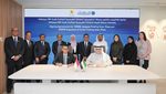 Darmawan Prasodjo, president director of PT PLN, and Mohamed Jameel Al Ramahi, CEO of Masdar, sign the solar plant agreements