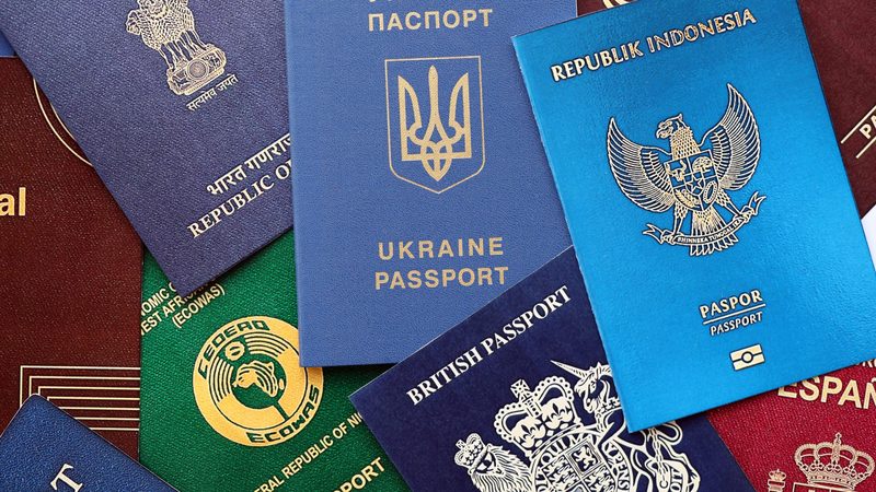 Many various passports of citizens of different countries and regions of the world close up