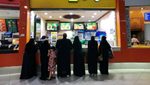 Saudi inflation women outside restaurant