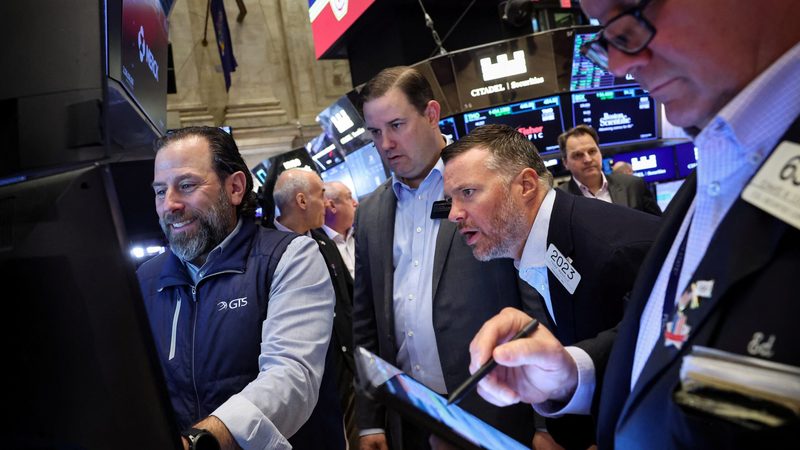 Traders work on the floor at the New York Stock Exchange. Markets have rebounded in early trading in the US and at close in the Middle East