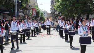 Christians march in a parade to celebrate Easter for the first time under the Islamist-led government control, in Damascus, Syria