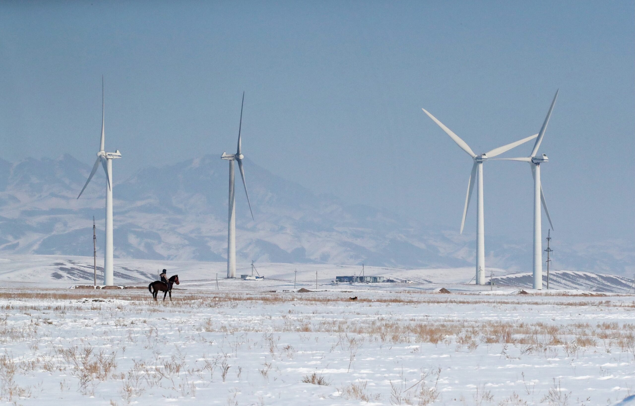 Wind turbines in the Almaty region, Kazakhstan. With help from Saudi company Acwa Power, the country is reducing the amount of fossil fuels in its energy mix
