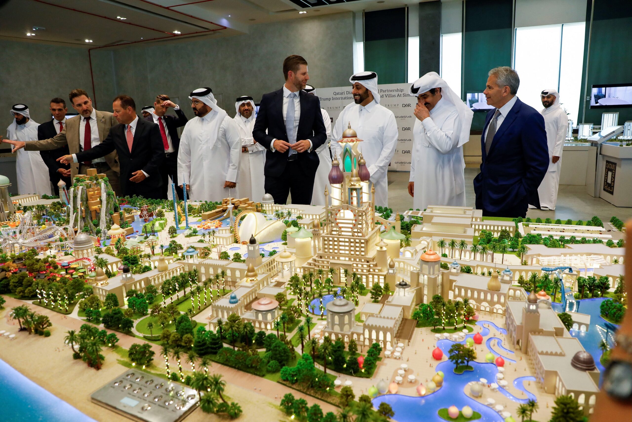 Eric Trump looks at a model of the Trump Organization's planned project in Qatar in partnership with Dar Global