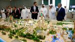 Eric Trump looks at a model of the Trump Organization's planned project in Qatar in partnership with Dar Global