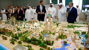Eric Trump looks at a model of the Trump Organization's planned project in Qatar in partnership with Dar Global