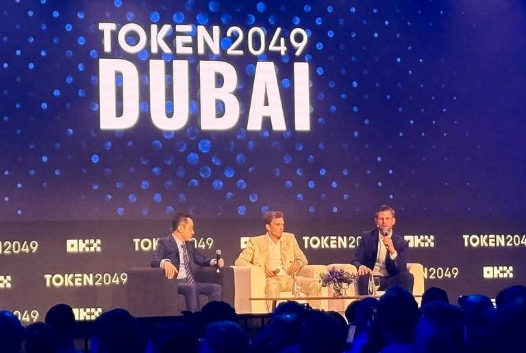 Eric Trump (right) speaks at Token2049