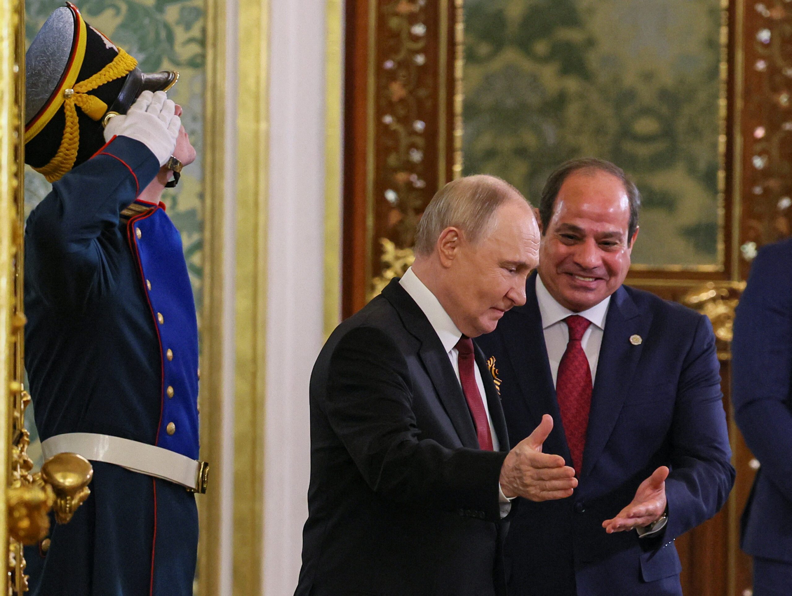 Russian President Vladimir Putin welcomes Egyptian President Abdel Fattah El-Sisi during their meeting in Moscow on May 9