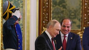 Russian President Vladimir Putin welcomes Egyptian President Abdel Fattah El-Sisi during their meeting in Moscow on May 9