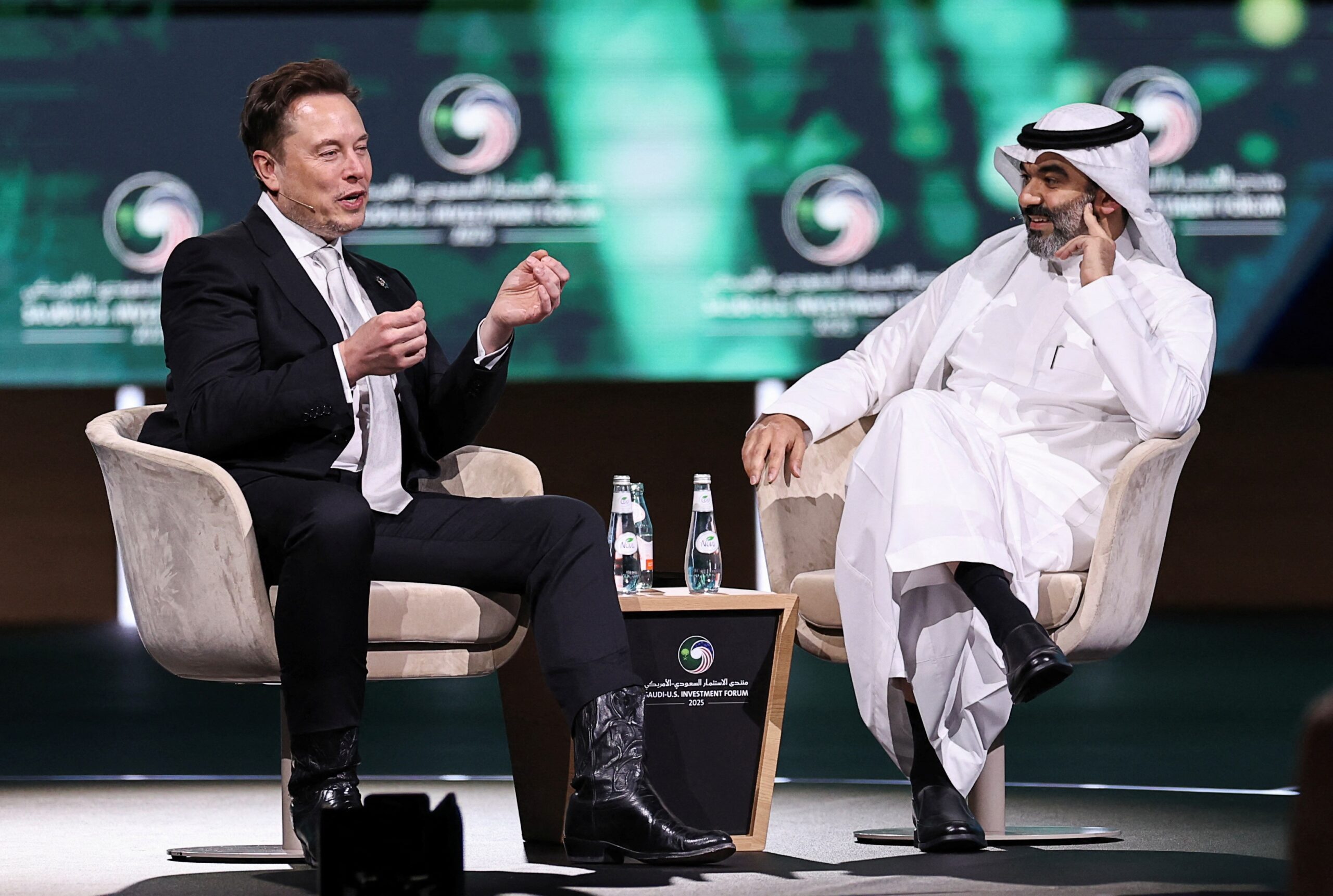 SpaceX and Tesla CEO Elon Musk speaks with Saudi minister of communications Abdullah Alswaha at the Saudi-US Investment Forum in Riyadh