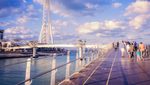 People walk towards Bluewaters Island, one of the developments in Dubai Residential REIT's $5.7bn portfolio